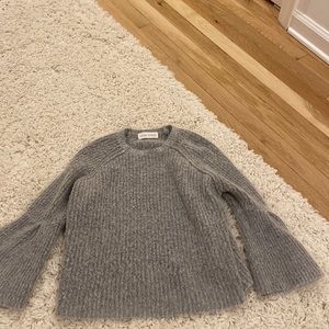 Gray sweater with flared sleeves